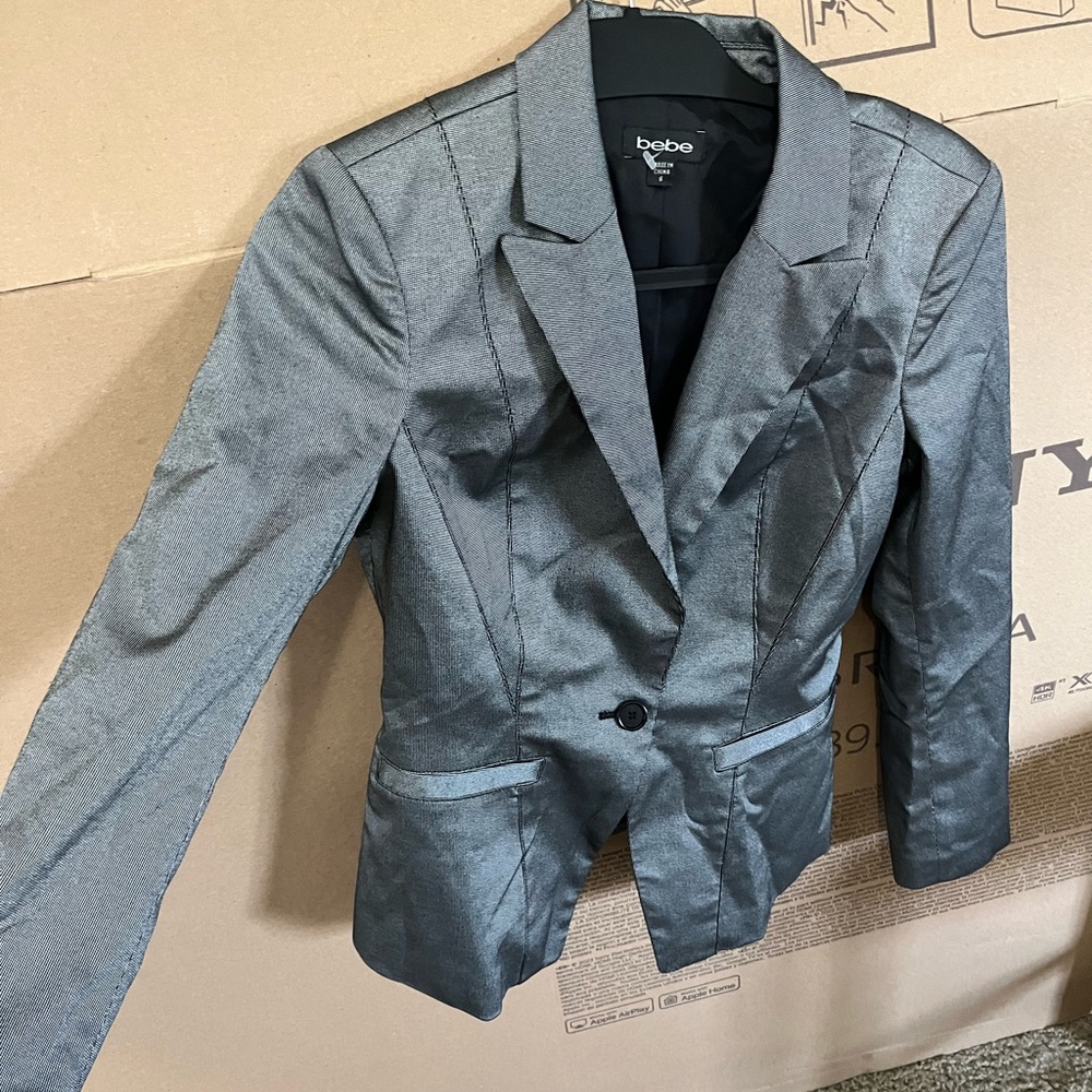Bebe Charcoal Blazer  It is a woman's in excellent condition, almost new